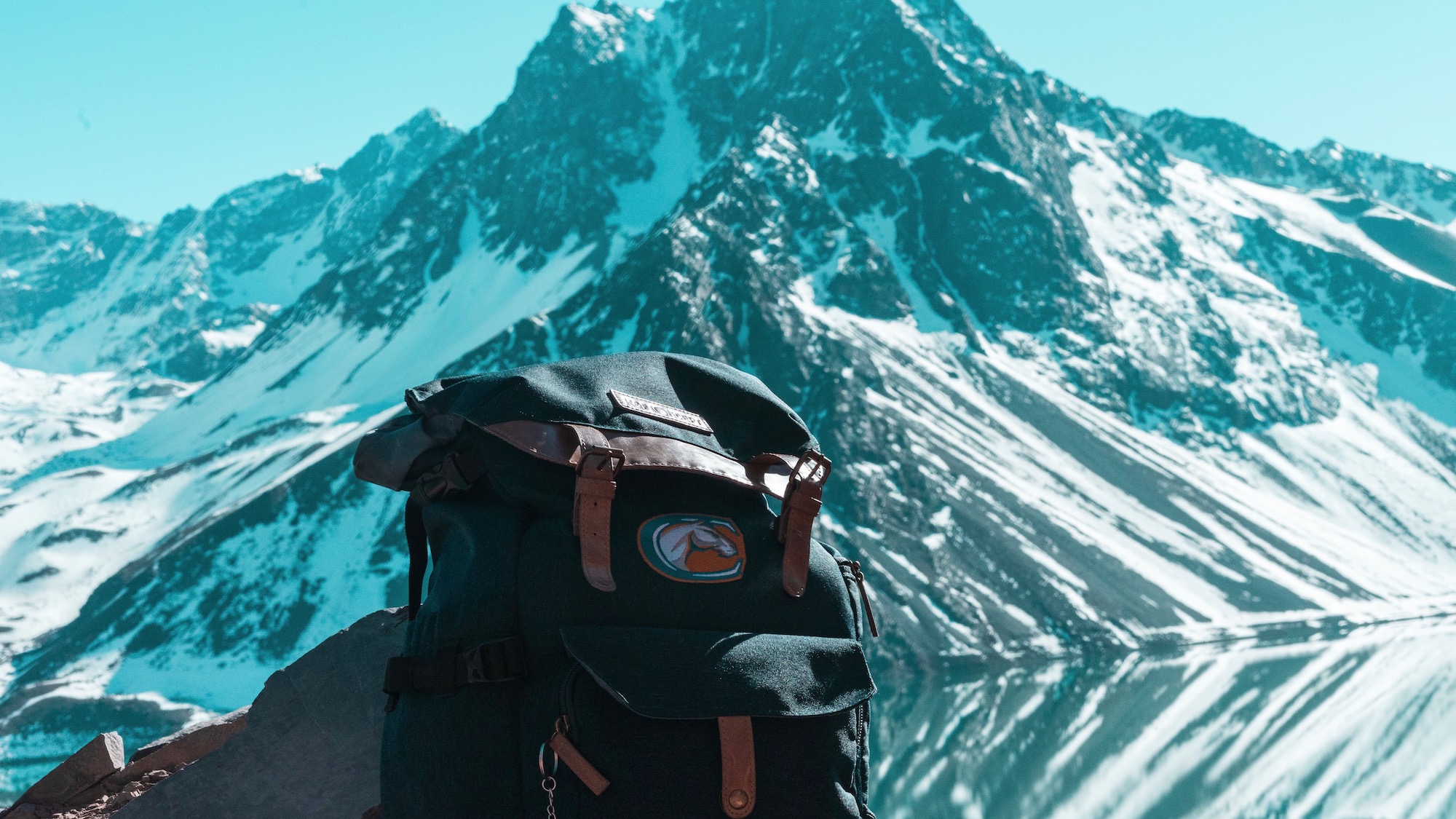Aggie backpack with mountains in background