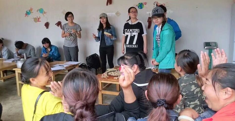 A group of farmers, consumers, and NGO practitioners investigating a CSA farm in a Bai village, southwest China. (Miaomiao Qi)