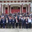 Attendees of the APRU Annual Presidents' Meeting stand for a picture in front of the Chinese Heritage Centre in SIngapore.